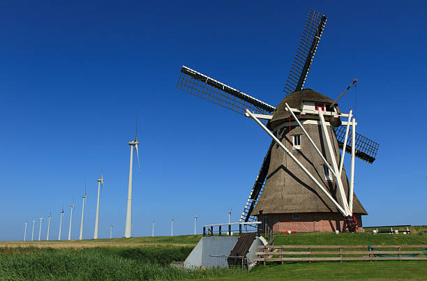 old & moderna - wind turbine motion alternative energy wind power fotografías e imágenes de stock