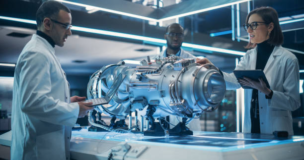 Smart Team of Engineers, Tech Scientist and Machinery Operators Collaborate on a New Type of a Electric Turbine Engine, Using Computers and Measuring Tools in Scientific Technology Lab