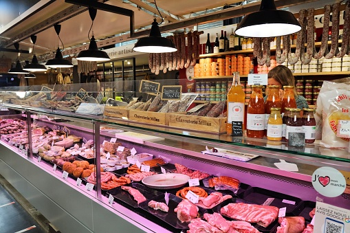 Local specialist butcher and charcuterie store in covered market of Albi, France. Albi is the prefecture town of the Tarn department.