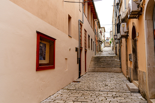 A small street in Fazana which was a small fishing village in Croatian Istria. It is one of the main landmarks for trips to Brioni National Park.