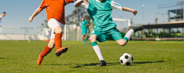 Soccer Showdown: Thrilling Match Action with Skillful Player on the Field | Captivating Image of Soccer Player in Action Soccer Showdown: Thrilling Match Action with Skillful Player on the Field | Captivating Image of Soccer Player in Action midfielder stock pictures, royalty-free photos & images