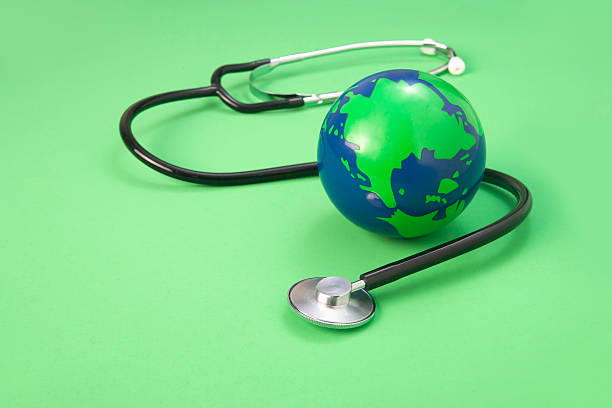 istock global and stethoscope on a green background 151909624