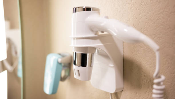 istock Elecric hairdryer in holder 1519117482