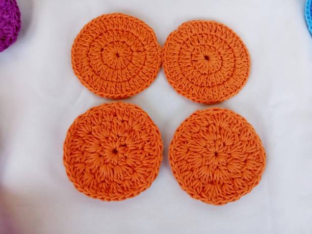 istock Crochet orange colour handmade cricle round background texture 1519118046