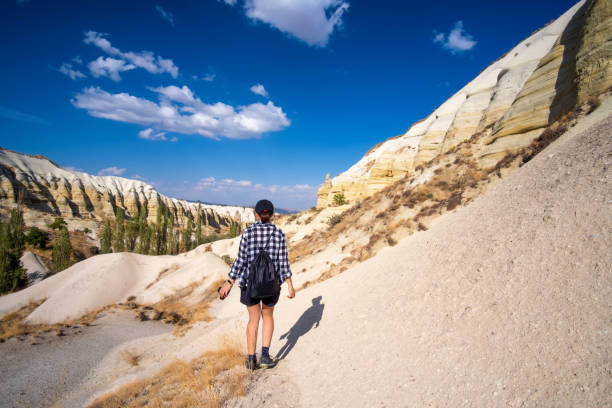 istock Tourist trekking between sand mountains 1519130379
