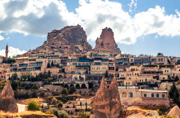 Uchisar settlement with modern houses on turkish mountain