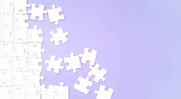 istock Puzzle pieces on pink background 1519141137