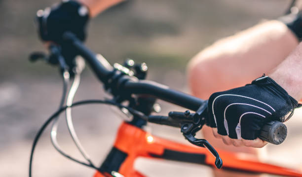 istock Hands in gloves on bike handlebar 1519162785