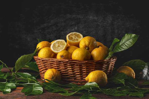 istock Fresh lemons in wooden basket 1519173113