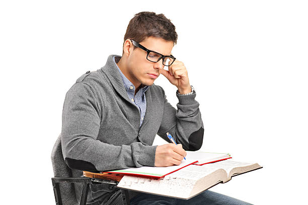 istock Young male in thoughts doing an exam 151919963