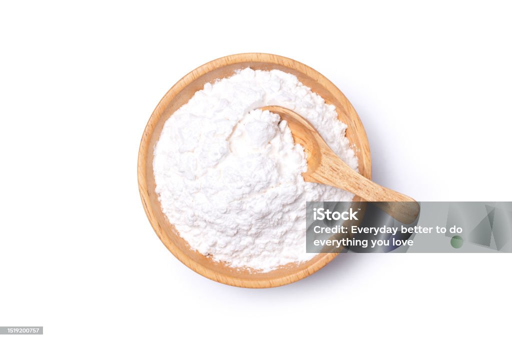 White powder in wooden bowl isolated on white White powder in wooden bowl isolated on white background with clipping path. Talcum Powder Stock Photo