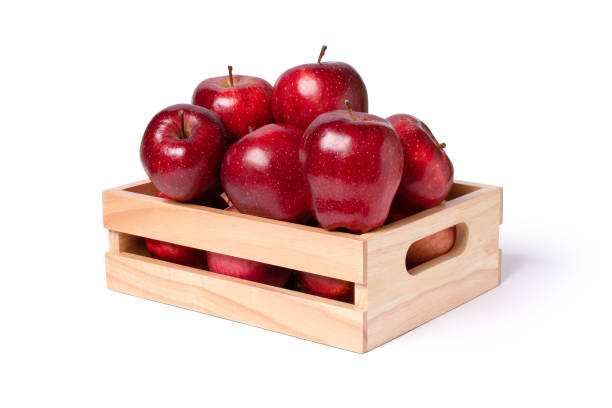 istock Red apple in wooden box (crate) isolated on white 1519200762