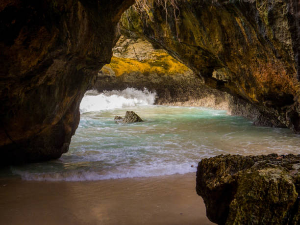 Praia Dona Ana is a popular beach cove near Lagos in the Algarve area of Portugal. The stunning beach is surrounded by imposing, colorful cliffs, stunning rock formations and the clear turquoise waters of the Atlantic Ocean.