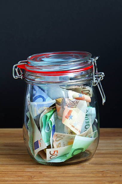istock Money in the preserving jar 151928935