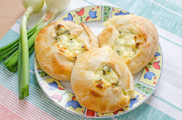 Knishes with cheese and scallions stock photo