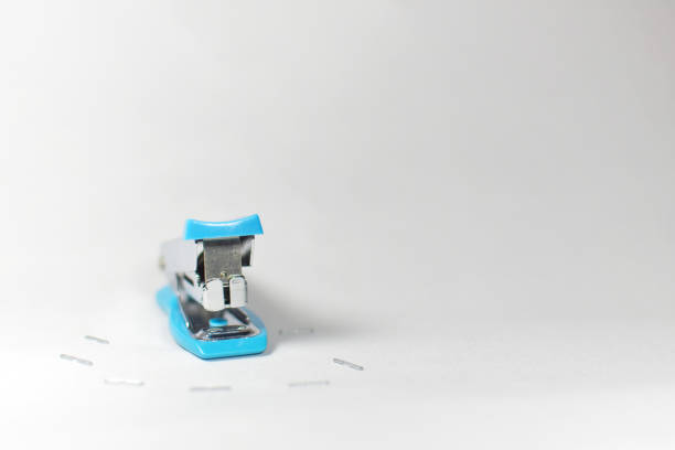 Small Blue office stapler isolated on white background.