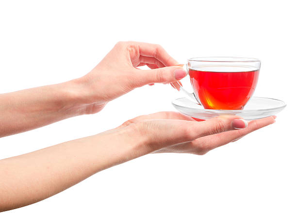 holding a cup of warm tea in hands