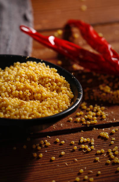 Panicum miliaceum is scientific name of Proso Millet cereal grain. Also known as Broomcorn Millet, Painco (portuguese) and Mijo (spanish).coarse rice, Closeup of grains Panicum miliaceum is scientific name of Proso Millet cereal grain. Also known as Broomcorn Millet, Painco (portuguese) and Mijo (spanish).coarse rice, Closeup of grains vj day stock pictures, royalty-free photos & images