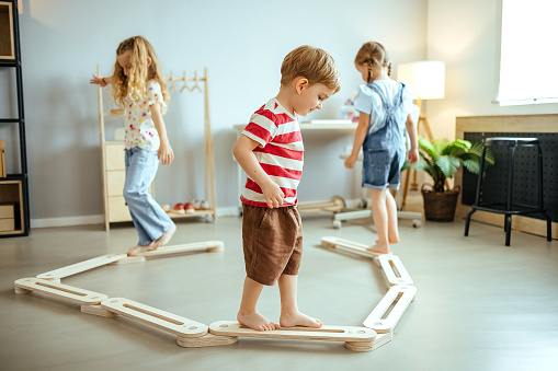Children play at home, maintain balance