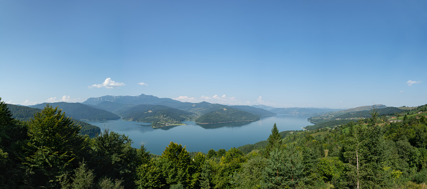 Panorama of Lake Izvorul Muntelui (Lacul Bicaz) and Ceahlau mountain. Carpathians, Romania