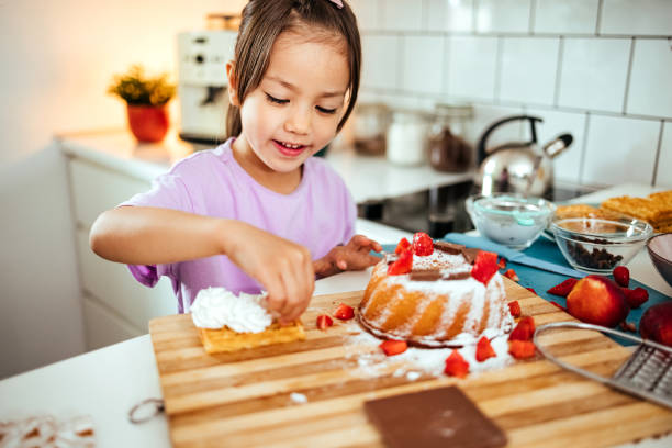 istock Girl enjoying cake in the kitchen 1519385773