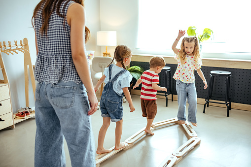 Children play at home, maintain balance