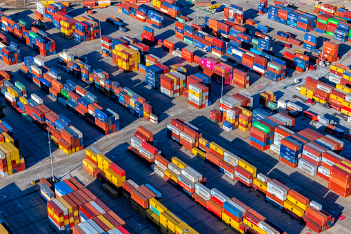 Mobile, United States - January 31, 2022:  The cargo container yard at the Port of Mobile, Alabama on a winter afternoon shot from an altitude of about 600 feet overhead.
