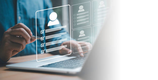 istock Headhunter using pen to tick correct mark to screening and select the optimum resume application form , Human development and recruitment to interview and join with company concept. 1519392749