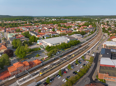 Aerial view of Alingsås town and the local train station with trains at the platform.