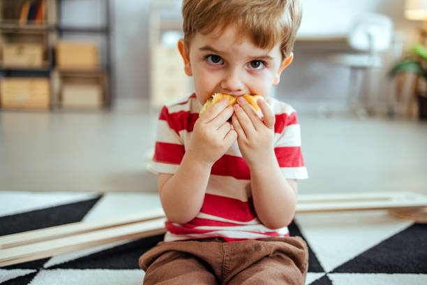istock Little boy eating at home 1519427947