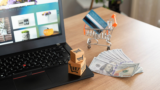 Credit card and cash on the table for online shopping