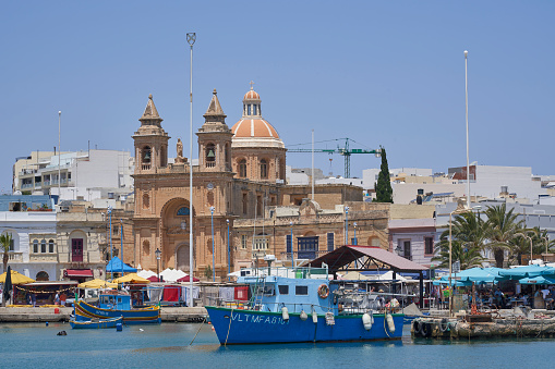 Marsaxlokk, Malta - June 7, 2023: Historic church in the historic fishing town of Marsaxlokk in Malta