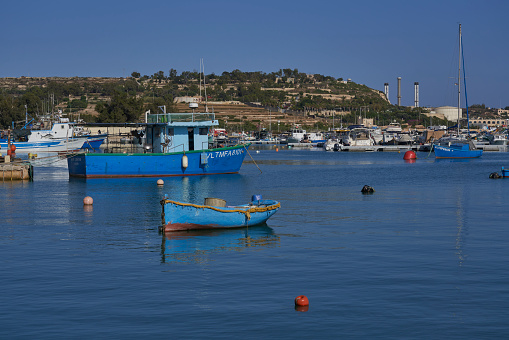 Fishing boats in the harbor of a small sea town.