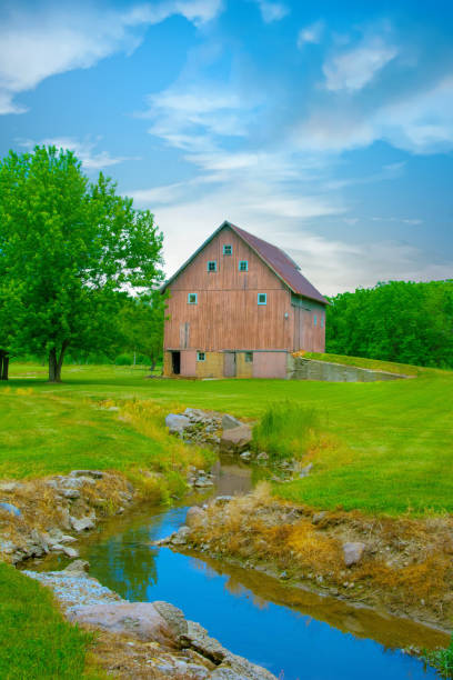 istock Old Weathered Barn with Small Stream-Miami County, Indiana 1519454445