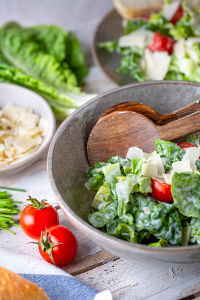 istock Green salad with tomatoes, bread and parmesan cheese 1519459255