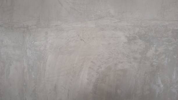 istock Bright light white gray grey grunge stone concrete plaster facade wall texture background 1519503953