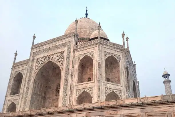 The Taj Mahal ('Crown of the Palace') is an ivory-white marble mausoleum on the right bank of the river Yamuna in Agra, Uttar Pradesh, India