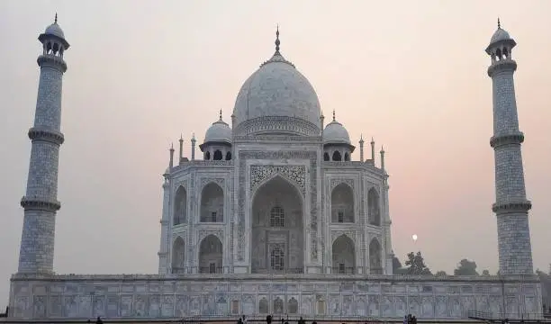 The Taj Mahal ('Crown of the Palace') is an ivory-white marble mausoleum on the right bank of the river Yamuna in Agra, Uttar Pradesh, India