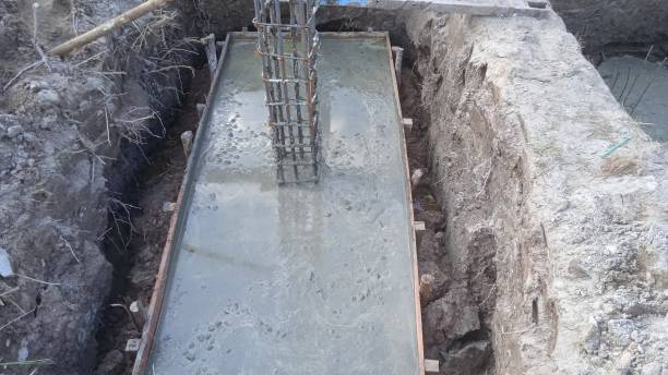 istock Foundation construction building site making reinforcement metal framework for pouring concrete 1519507222