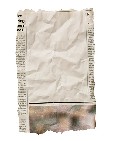 Torn-out piece from a newspaper with blank space for your article, advertisement or picture. The articles are on business topics. The text, layout and photo are simulated by the photographer, so this image is free of third-party copyright and may be used for any purpose.