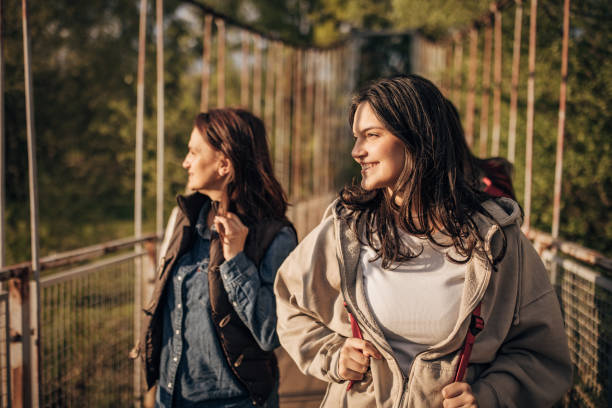 istock Mother and daughter on a small bridge 1519540903
