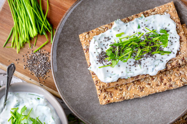 istock Crispbread, fresh curd, herbs and chia seeds 1519567500