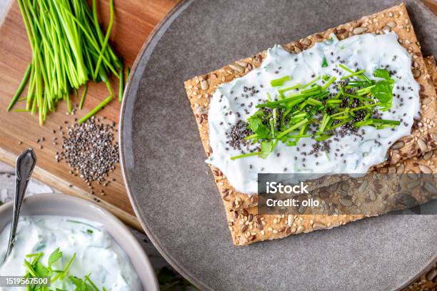 Crispbread Fresh Curd Herbs And Chia Seeds Stock Photo - Download Image Now - Appetizer, Bowl, Bread