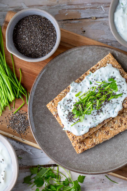 istock Crispbread, fresh curd, herbs and chia seeds 1519567531