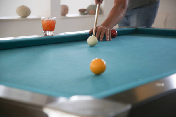 istock Playing billiard - Close-up shot of a man playing table pool game 1519604453