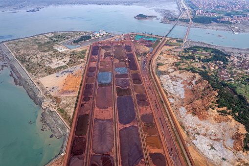 Aerial view of metal raw materials stacked at the freight terminal