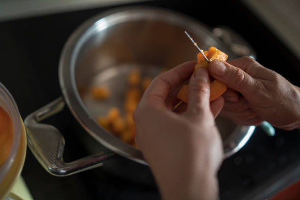 istock Female hands cutting fresh sweet peaches 1519661780