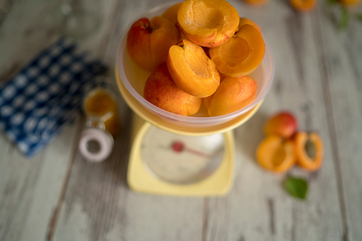 Apricots on the scale. Rustic colorful style image.