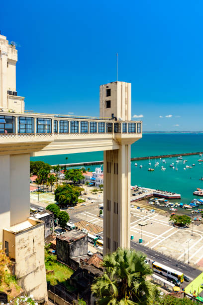 Lacerda Elevator with the harbor and Todos os Santos bay Lacerda Elevator with the harbor and Todos os Santos bay in the background in the city of Salvador in Bahia lacerda elevator stock pictures, royalty-free photos & images