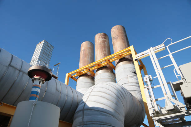 Oil and gas production process with the machine or turbine unit. The exhaust line of the engine on oil and gas platform. The unit was operated and service by technician and maintenance by engineer. Oil and gas production process with the machine or turbine unit. The exhaust line of the engine on oil and gas platform. The unit was operated and service by technician and maintenance by engineer. greenhouse nightclub nyc photos stock pictures, royalty-free photos & images